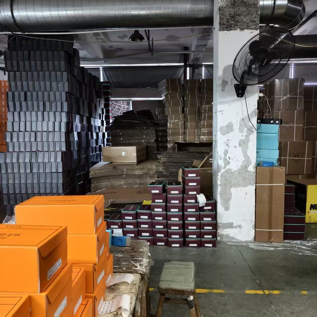 Shoe boxes staged for packing